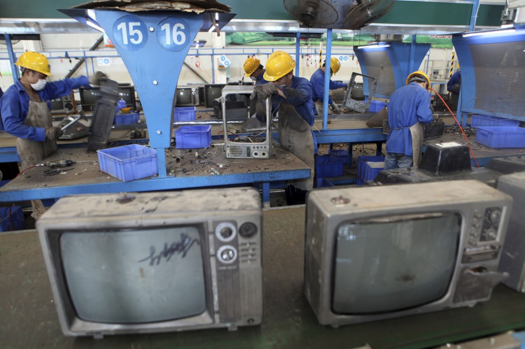 Television sets await recycling at a workshop in an environmental technology company in Zhuzhou in southern China’s Hunan province. Environmentalists have long complained that China’s recycling industry is poisoning the air, water and soil.