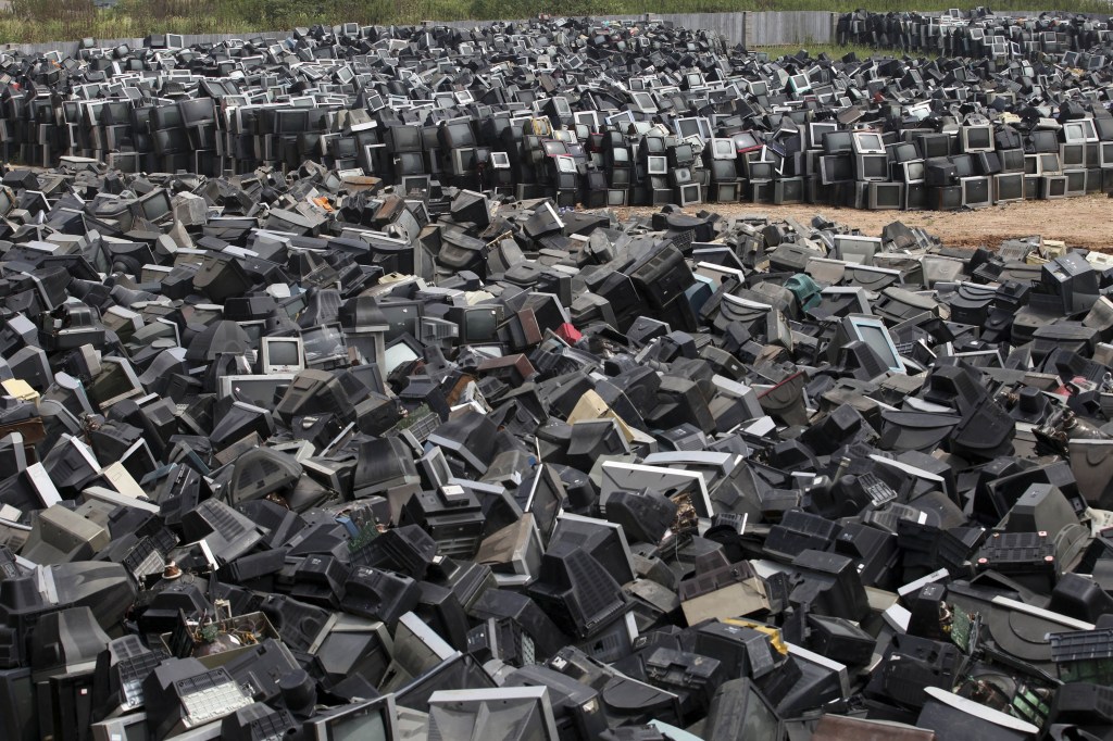 Discarded television sets pile up in a scrap yard awaiting recycling in Zhuzhou city in south China’s Hunan province. China’s recycling industry has boomed over the past 20 years. Its manufacturers needed the metal, paper and plastic and Beijing was willing to tolerate the environmental cost.