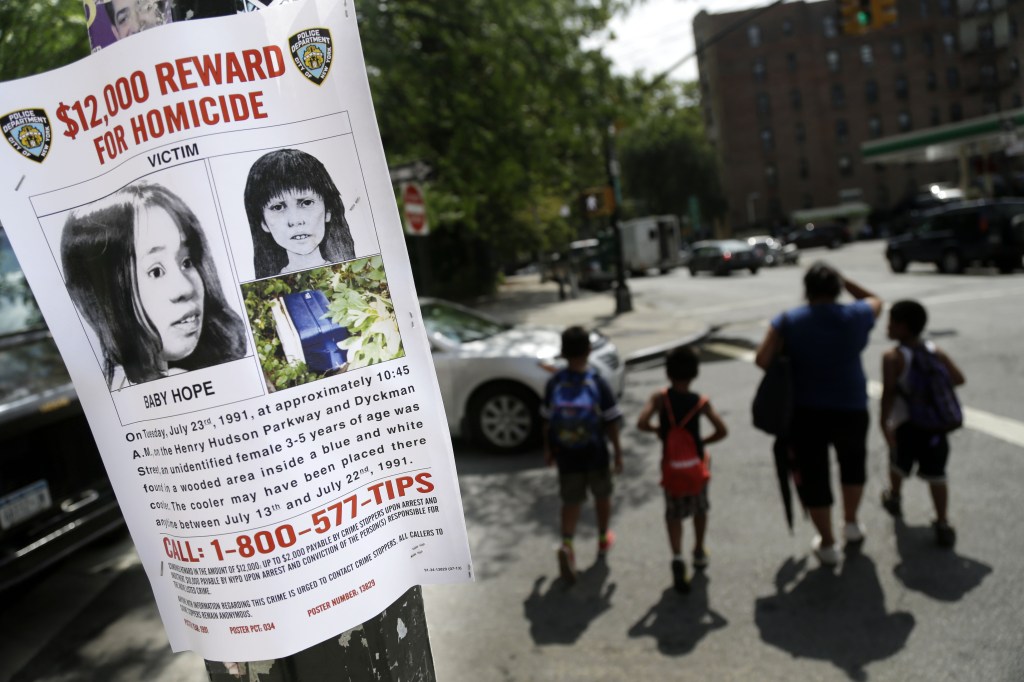 A poster solicits information regarding an unidentified body near the site where the body was found in New York. Police in New York City said Saturday that they had arrested the killer of a child who was nicknamed Baby Hope by detectives after her body was discovered inside a picnic cooler beside a Manhattan highway in 1991.