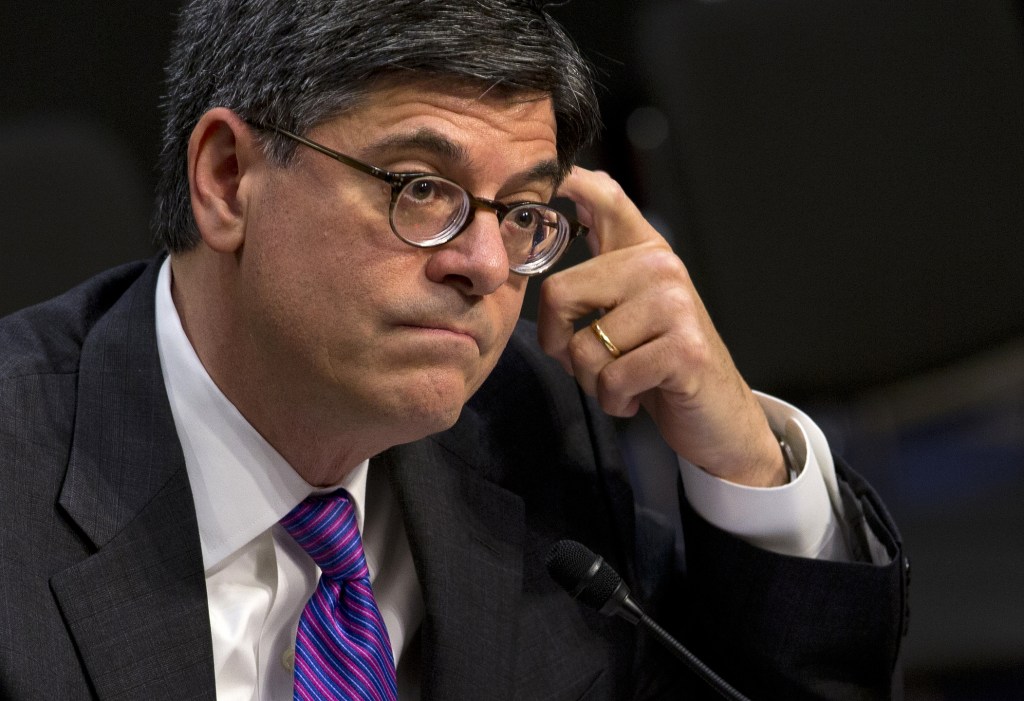 Treasury Secretary Jacob Lew listens while testifying on Capitol Hill on Thursday before the Senate Finance Committee to urge Congress to reopen the government and lift the U.S. borrowing cap.