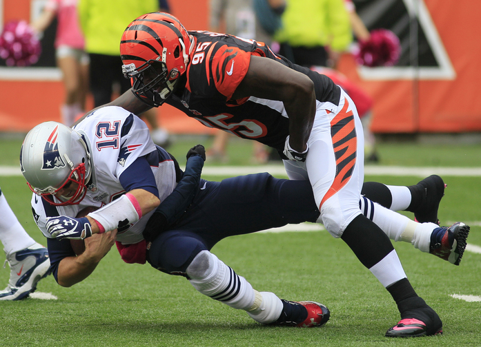 Patriots quarterback Tom Brady is sacked by Bengals defensive end Wallace Gilberry in the first half Sunday Cincinnati.