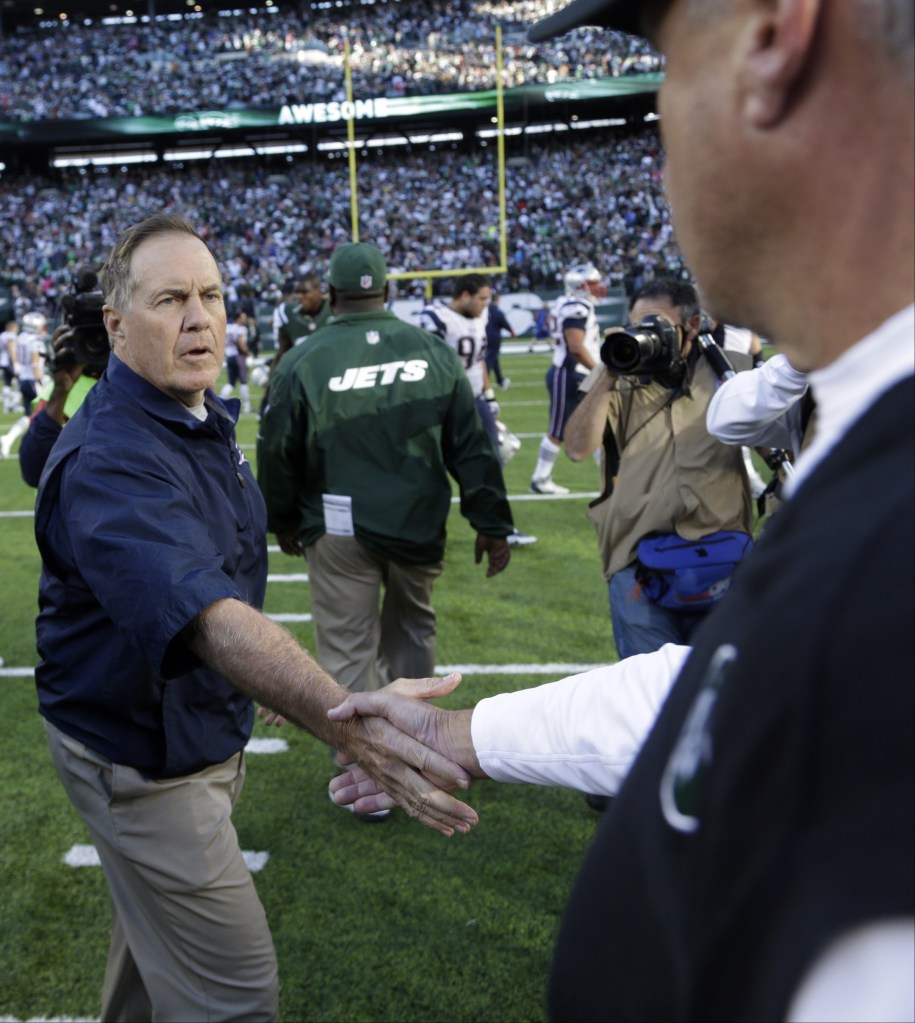 New England Patriots head coach Bill Belichick shakes hands with New York Jets head coach Rex Ryan after an NFL football game Sunday, Oct. 20, 2013 in East Rutherford, N.J. The Jets won the game 30-27.