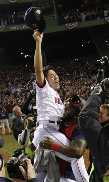 Boston Red Sox's David Ortiz lifts relief pitcher Koji Uehara after Boson defeated the St. Louis Cardinals in Game 6 of baseball's World Series Wednesday, Oct. 30, 2013, in Boston. The Red Sox won 6-1 to win the series. (AP Photo/Matt Slocum)