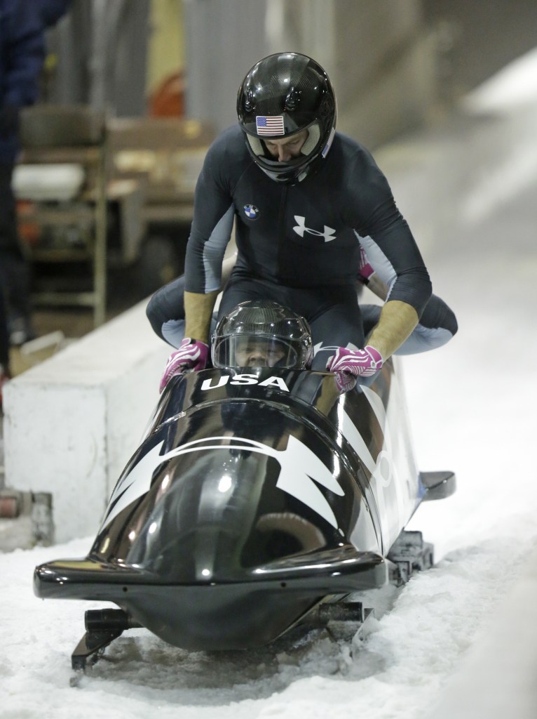 From front to back, Steve Holcomb and Curt Tomasevicz come to a stop after racing in the United States four-man bobsled team trials on Saturday. Holcomb and his crew came in first place.