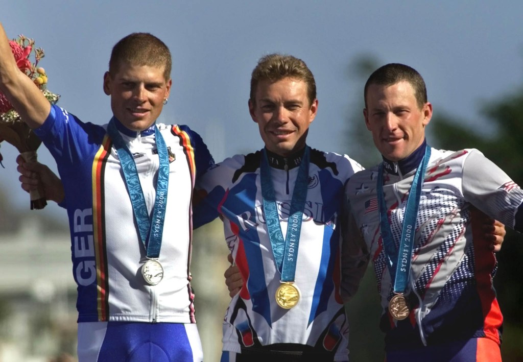 Bronze medal winner Lance Armstrong, right, is shown with Germany’s silver medal winner Jan Ullrich, left, and Russia’s Viacheslav Ekimov, winner of the gold medal, in the men’s individual time trial in Sydney during the 2000 summer Olympics. The International Olympic Committee stripped Armstrong of the medal after he admitted to doping.