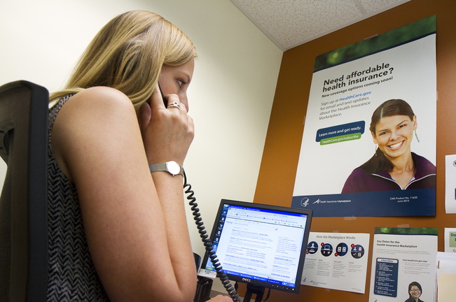 With the health insurance marketplace open for business, Outreach Specialist Libby Cummings, at Portland Community Health Center, answers questions on the phone about the new system on Oct. 1.