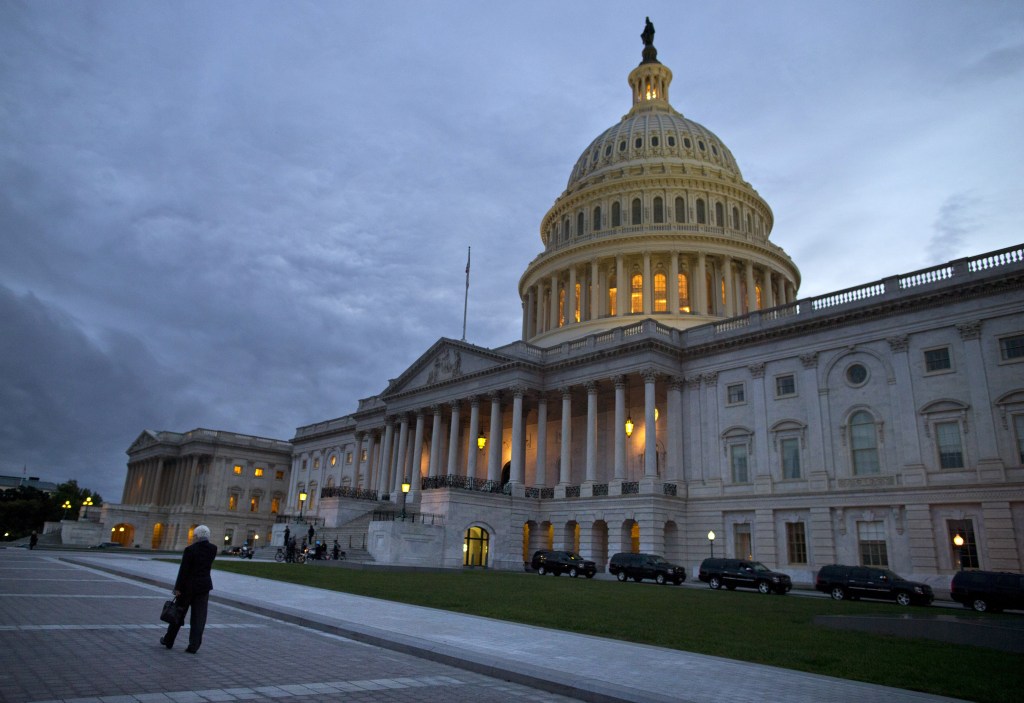 This Oct. 15, 2013, photo, shows a view of the U.S. Capitol building at dusk in Washington. Even if Congress reaches a last-minute or deadline-busting deal to avert a federal default and fully reopen the government, elected officials are likely to return to their grinding brand of brinkmanship, perhaps repeatedly. House-Senate talks are barely touching the underlying causes of debt-and-spending stalemates that pushed the country close to economic crises in 2011, last December and again this month.