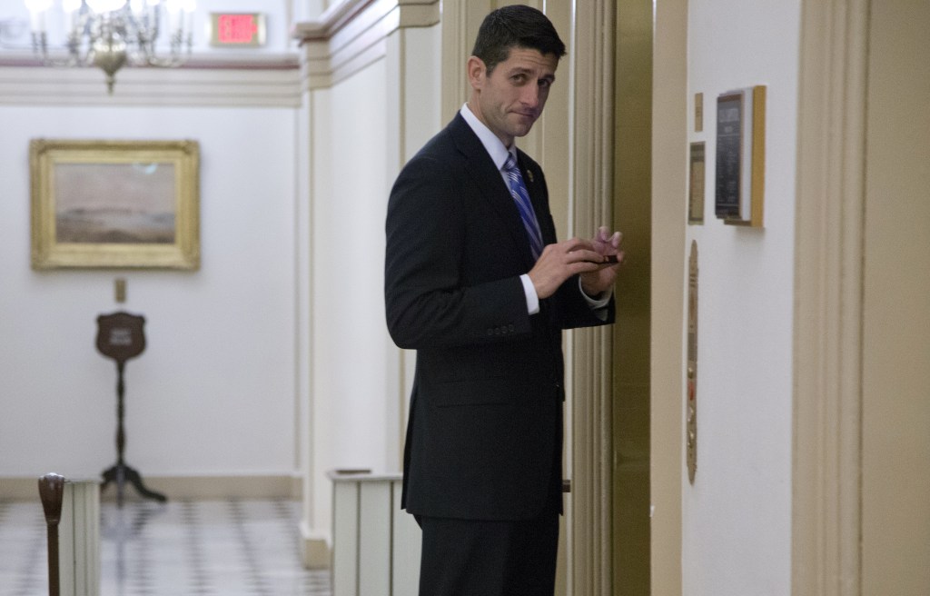 Rep. Paul Ryan, R-Wis., glances to media stands ready to board the elevator that serves the office of House Speaker John Boehner of Ohio, on Capitol Hill, Tuesday, Oct. 15, 2013, in Washington. The partial government shutdown is in its third week and less than two days before the Treasury Department says it will be unable to borrow and will rely on a cash cushion to pay the country’s bills.
