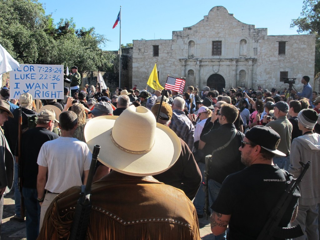 Gun rights advocates gather at the Alamo in San Antonio, Texas on Oct. 19, 2013 to demonstrate in support of a Texas law that permits the open carry of long arms, such as rifles and shotguns. Organizers said a local ordinance restricting the carrying of firearms in public conflicts with state law.