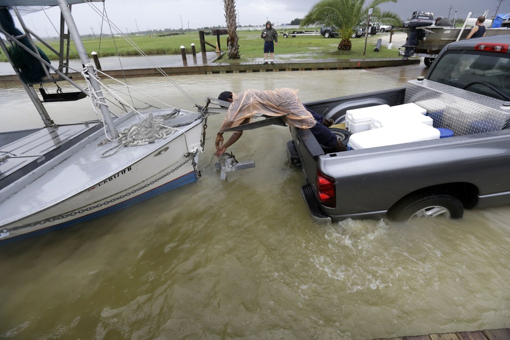 C.J. Johnson pulls a shrimp boat out of the water in preparation for the arrival of Tropical Storm Karen, at Myrtle Grove Marina in Plaquemines Parish, La., on Friday.