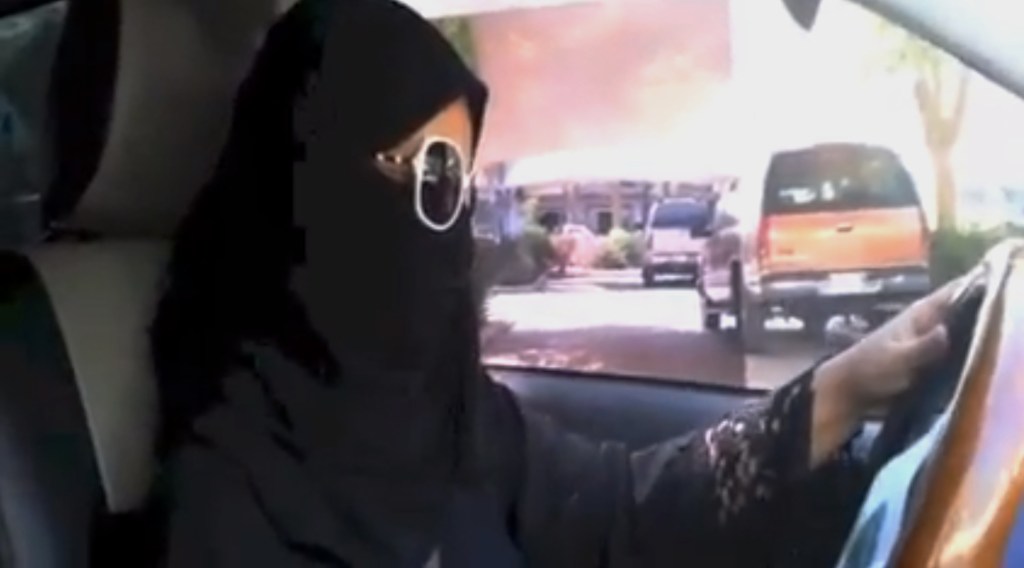 In this image made from video provided by theOct26thDriving campaign, which has been authenticated based on its contents and other AP reporting, a Saudi woman drives a vehicle in Riyadh, Saudi Arabia on Saturday. A Saudi woman said she got behind the wheel Saturday and drove to the grocery store without being stopped or harassed by police, kicking off a campaign protesting the ban on women driving in the ultraconservative kingdom.