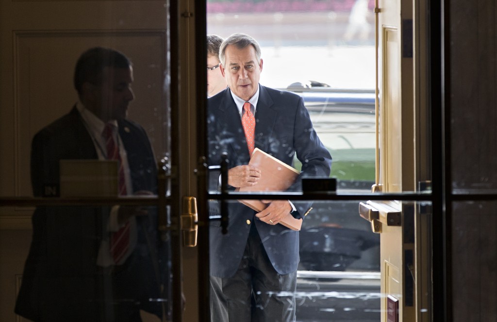 Speaker of the House John Boehner, R-Ohio, arrives at the Capitol in Washington on Saturday. The Republican-controlled House and the Democrat-controlled Senate are at an impasse, neither side backing down after House GOP conservatives linked the funding bill to obstructing President Obama’s signature health care law. There has been no sign of progress toward ending the government shutdown that has idled 800,000 federal workers and curbed services around the country.