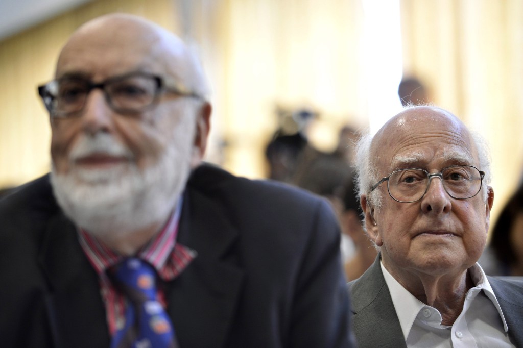 In this July 2012 photo, Belgium physicist Francois Englert, left, and British physicist Peter Higgs answer journalists’ questions at the European Organization for Nuclear Research (CERN) in Meyrin near Geneva, Switzerland.