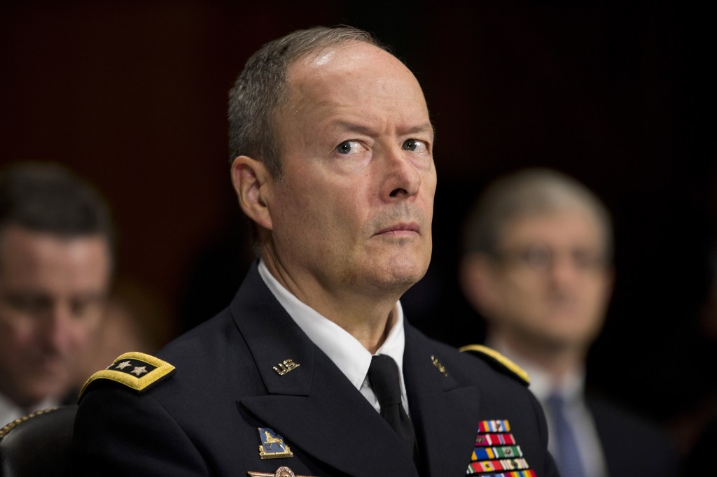National Security Agency Director Gen. Keith Alexander pauses while testifying on Capitol Hill Wednesday before the Senate Judiciary Committee oversight hearing on the Foreign Intelligence Surveillance Act. U.S. intelligence officials say the government shutdown is seriously damaging the intelligence community’s ability to guard against threats.