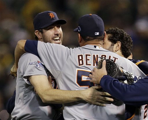 Detroit Tigers pitcher Joaquin Benoit (53) is congratulated by starting pitcher Justin Verlander, left, after the Tigers beat the Oakland Athletics 3-0 to win Game 5 of an American League baseball division series in Oakland, Calif., Thursday, Oct. 10, 2013. (AP Photo/Marcio Jose Sanchez) O.co Coliseum