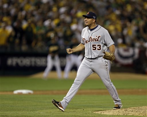 Detroit Tigers pitcher Joaquin Benoit shouts after striking out the last batter in the ninth inning for a 3-2 win over the Oakland Athletics in Game 1 of the American League baseball division series in Oakland, Calif., Friday, Oct. 4, 2013. (AP Photo/Ben Margot) O.co Coliseum