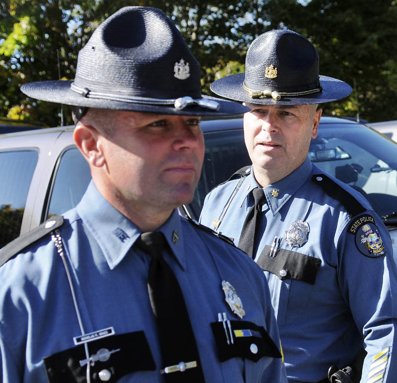 State Police Maj. Gary Wright, right, inspects Sgt. Nicholas Grass Tuesday during an inspection by the agency's command staff at the capitol in Augusta. Troopers from across the region assembled outside the State House to be reviewed individually by the agency's majors and colonels during the ceremony.