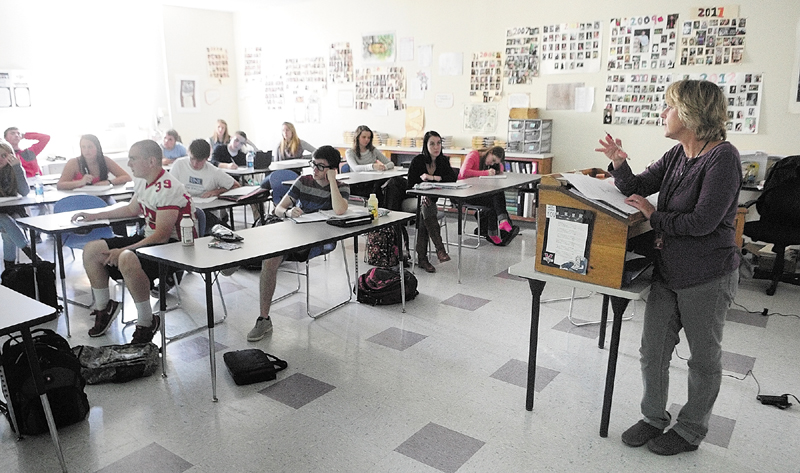 Laurie Rodrigue talks to her college prep English 4 class before students start doing presentations on Friday at Capital Area Tech Center in Augusta.