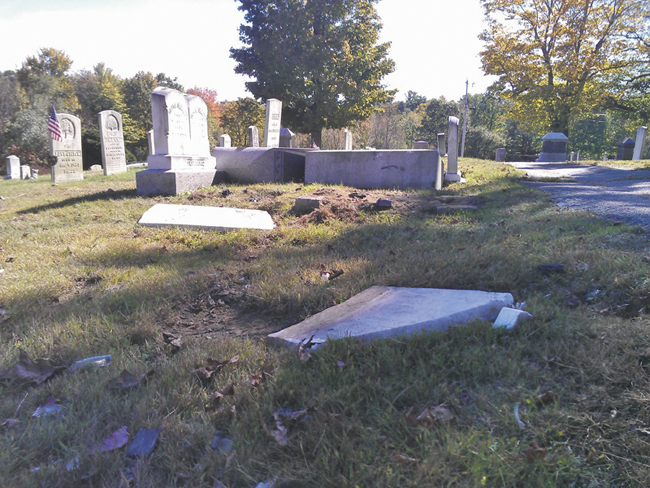 Police say a mother and daughter caused an estimated $34,000 of damage to headstones in Monmouth Ridge Cemetery.