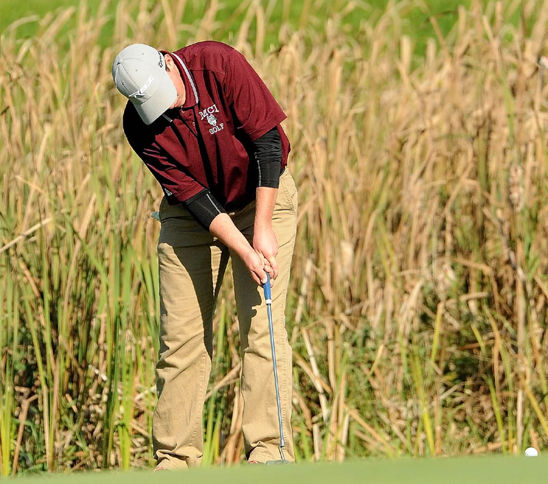 Maine Central Institute's Gavin Dugas putts on the 18th hole during the individual golf championships at Natanis Golf Course in Vassalboro on Saturday.