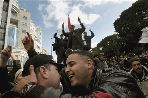Police officers celebrate the ouster of their president as they demonstrate in Tunis on Jan. 22, 2011. Almost a quarter-century ago, a young American political scientist achieved global academic celebrity by proclaiming that the collapse of communism had ended the discussion on how to run societies, leaving "Western liberal democracy as the final form of human government." In Egypt and around the Middle East, after a summer of violence and upheaval, the discussion, however, is still going strong. And almost three years into the Arab Spring revolts, profound uncertainties remain.