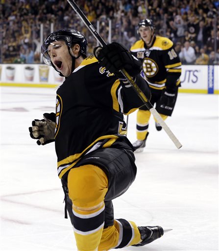 Boston Bruins forward Jordan Caron celebrates after scoring a goal during the second period Saturday against the Detroit Red Wings in Boston.