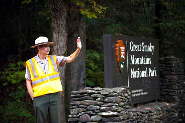OPEN FOR BUSINESS: Great Smoky Mountains National Park Superintendent Dale Ditmanson greets visitors to the reopened park near Townsend, Tenn., on Wednesday.