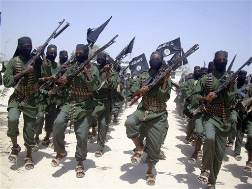 Al-Shabab fighters march with their weapons during military exercises on the outskirts of Mogadishu, Somalia, on Feb. 17, 2011. Foreign military forces carried out a pre-dawn strike today against foreign fighters in the same southern Somalia village where U.S. Navy SEALs four years ago killed a most-wanted al-Qaida operative, officials said.