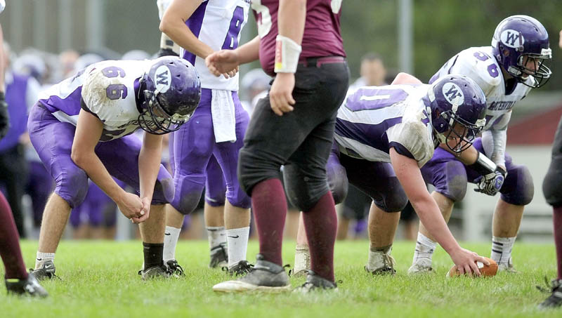 BIG MEN UP FRONT: Waterville Senior High School offensive linemen, from left to right, Alex Danner, Ben Cox and Luke Knight have helped the Puplr Panthers average almost 47 points per game this season.