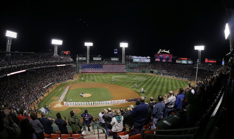 Players line up for the national anthem before Game 1 of baseball's World Series between the Boston Red Sox and the St. Louis Cardinals Wednesday, Oct. 23, 2013, in Boston. MLB