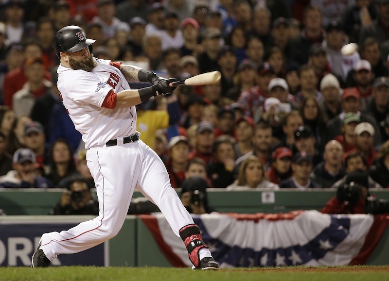 Boston Red Sox's Mike Napoli hits a three-run scoring double during the first inning of Game 1 of baseball's World Series against the St. Louis Cardinals Wednesday, Oct. 23, 2013, in Boston. MLB