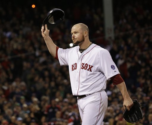 Boston Red Sox starting pitcher Jon Lester acknowledges the crowd as he leaves the game during the eighth inning of Game 1 of baseball's World Series against the St. Louis Cardinals Wednesday, Oct. 23, 2013, in Boston. (AP Photo/David J. Phillip) MLB