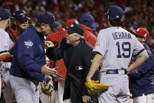Boston Red Sox manager John Farrell argues with home plate umpire Dana DeMuth after St. Louis Cardinals scored the winning run on an obstruction play during the ninth inning of Game 3 of baseball's World Series Saturday, Oct. 26, 2013, in St. Louis. The Cardinals won 5-4 to take a 2-1 lead in the series. (AP Photo/Matt Slocum) MLB