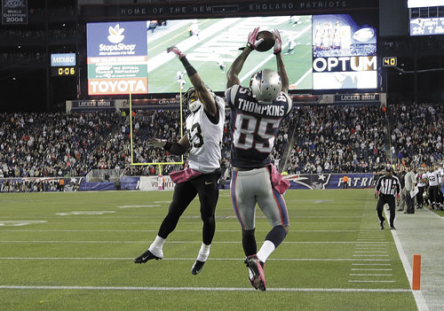 NICE GRAB: New England Patriots wide receiver Kenbrell Thompkins (85) catches the winning touchdown against New Orleans Saints cornerback Jabari Greer in the fourth quarter Sunday in Foxborough, Mass.