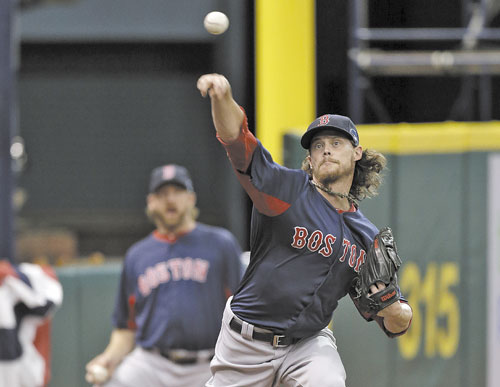 GETTING PREPARED: Boston Red Sox starting pitcher Clay Buchholz throws a bullpen session during practice for today’s Game 3 of the American League Division Series against the Tampa Bay Rays on Sunday in St. Petersburg, Fla.