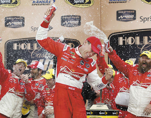 ANOTHER WIN: Kevin Harvick celebrates in victory lane after winning the Hollywood Casino 400 on Sunday at Kansas Speedway in Kansas City, Kan.