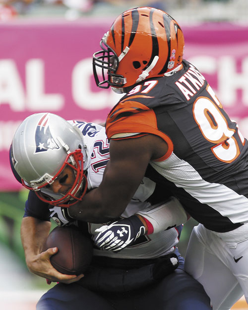 GOING NOWHERE: New England Patriots quarterback Tom Brady (12) is sacked by Cincinnati Bengals defensive tackle Geno Atkins in the first half Sunday in Cincinnati.