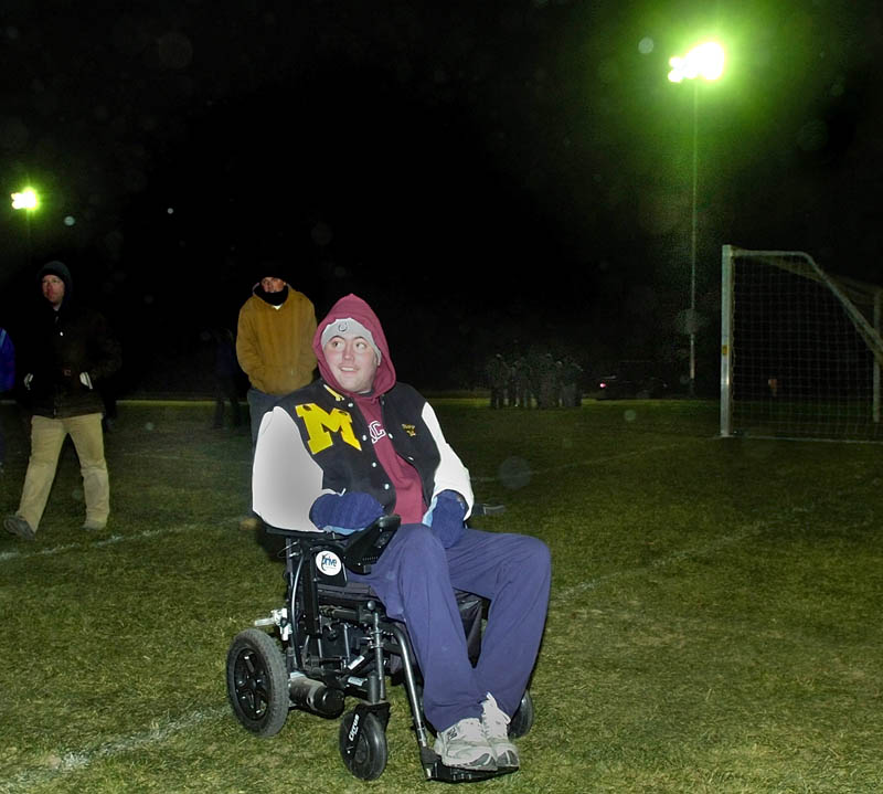Ricky Gibson rolls across the football field after flipping the switch to turn on the newly installed lights in this Nov. 2008 photo. READFIELD MARANACOOK RICKY GIBSON