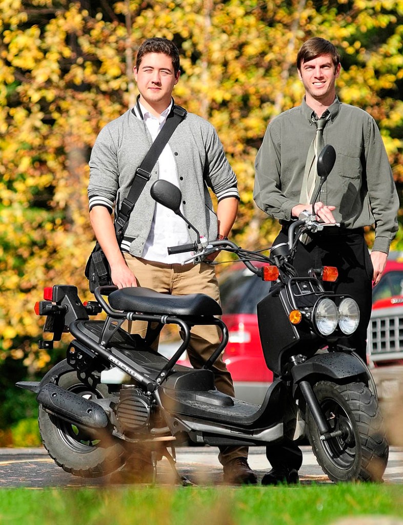 Myles Chung and Dan Emery on Thursday with a Honda Ruckus in Augusta. The pair plan to ride on scooters across the county next year.