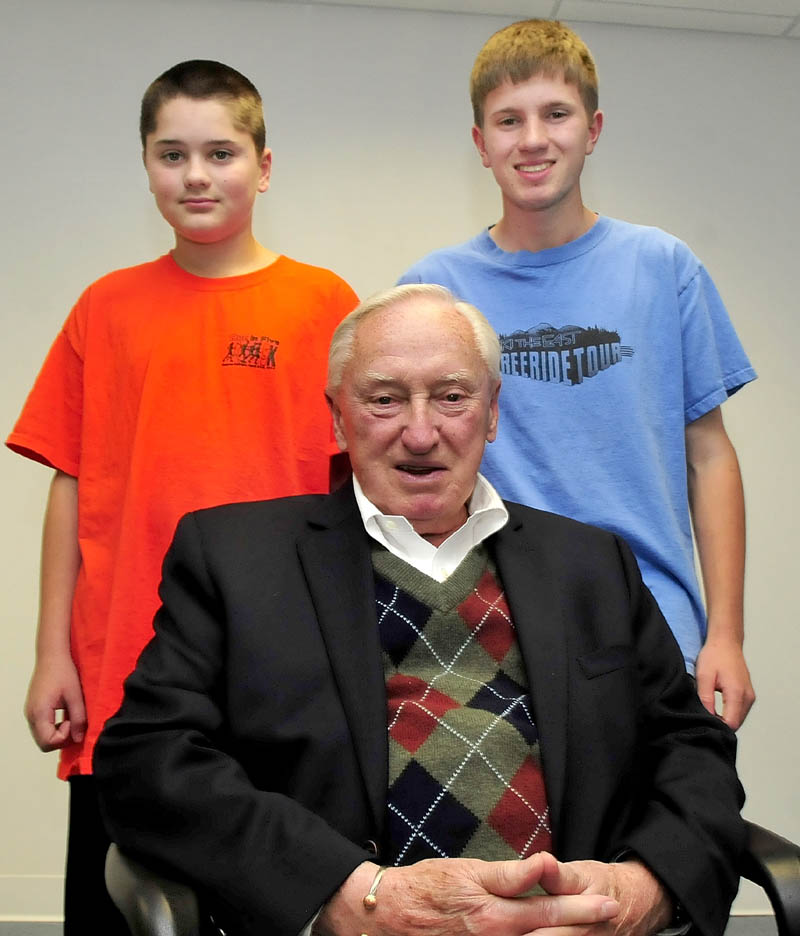 Red Sox baseball fan Charlie Gaunce is surrounded by his grandsons Daniel, left, and C.J. Gaunce.