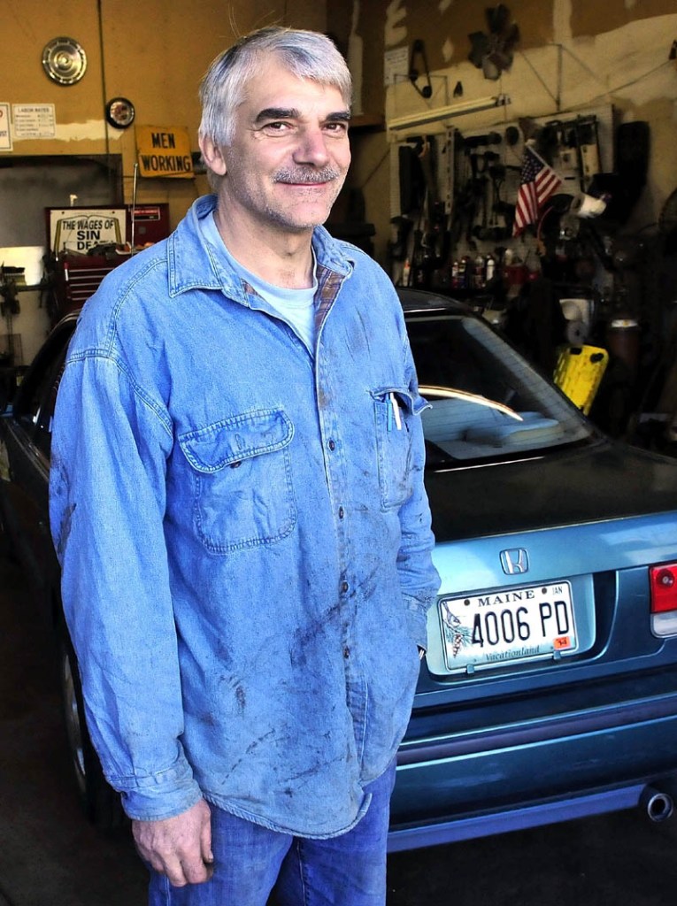 Peter Winslow is pictured in his garage in New Sharon. Winslow said he worked on John Pelletier's vehicle and may have been his only area friend before he died in an accident earlier this year.