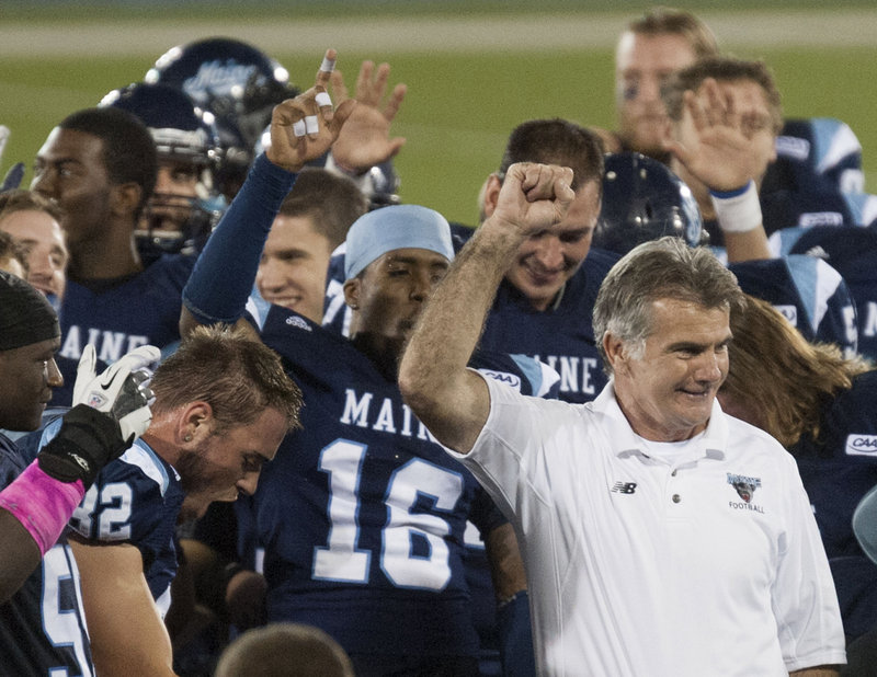 UMaine Coach Jack Cosgrove is all smiles after his Black Bears put on an offensive clinic that resulted in black and blue Blue Hens.