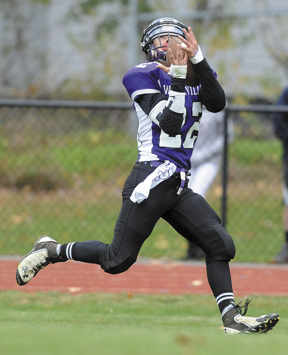 HAULING IN THE CATCH: Waterville Senior High School’s Dalton Denis catches a touchdown pass against Winslow High School in the Battle of the Bridge on Saturday in Waterville. Waterville defeated Winslow 25-21.