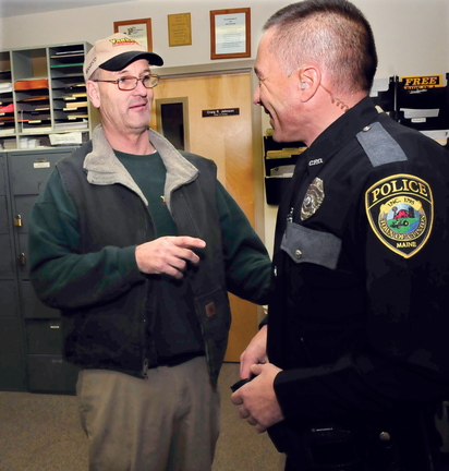 PROMOTED: Clinton police officer Rusty Bell, left, has been promoted to the rank of sergeant. Bell speaks with patrolman Karl Roy.
