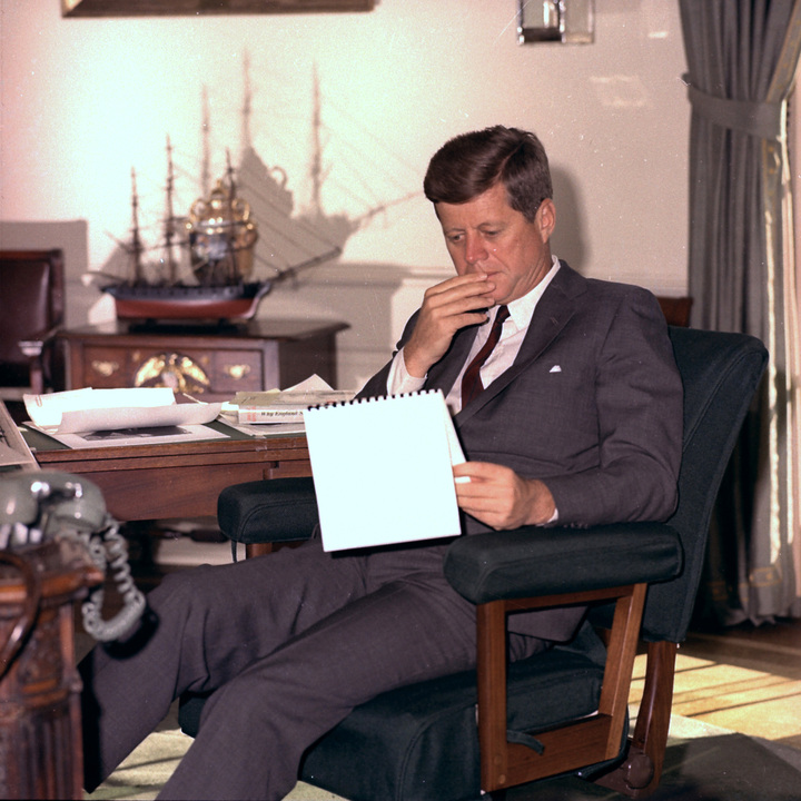 In this Jan. 18, 1962 file photo, U.S. President John F. Kennedy looks over notes at his desk in the White House.