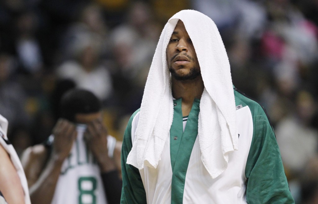 TOUGH NIGHT: Boston Celtics forward Jared Sullinger (7) wraps his head in a towel during the first quarter of an NBA basketball game against the Indiana Pacers, Friday, Nov. 22, 2013, in Boston. The Pacers defeated the Celtics 97-82. (AP Photo/Charles Krupa)