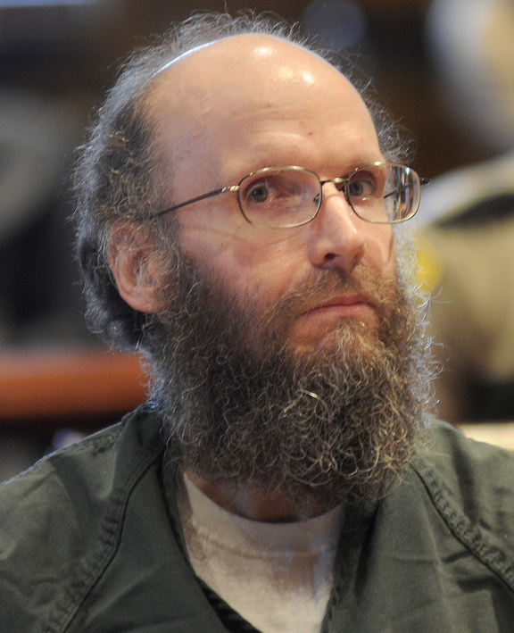 ADMISSION: Christopher Knight sits in the Kennebec County Superior Court on Monday in Augusta while entering guilty pleas for multiple burglaries and thefts while living in the woods of central Maine for 27 years. Knight agreed to plead guilty in exchange for receiving an alternative sentence with the Co-Occurring Disorders Court, a special, intensive supervision program where he will live and work in the community while reporting weekly to a judge.