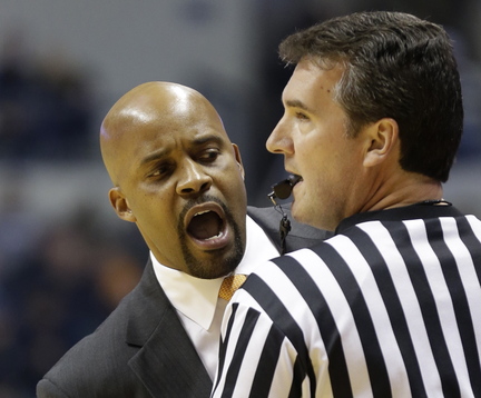 Tennessee coach Cuonzo Martin questions an official in the first half of an NCAA college basketball game against Xavier on Tuesday in Cincinnati. Referees are more tightly enforcing the rules this season.