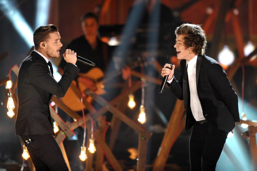 Liam Payne, left, and Harry Styles of the musical group One Direction perform on stage at the American Music Awards at the Nokia Theatre L.A. Live on Sunday, Nov. 24, 2013, in Los Angeles.
