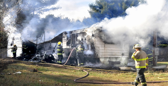 GONE: Madison firefighters put out the fire that destroyed a mobile home on Preble Avenue on Thursday,